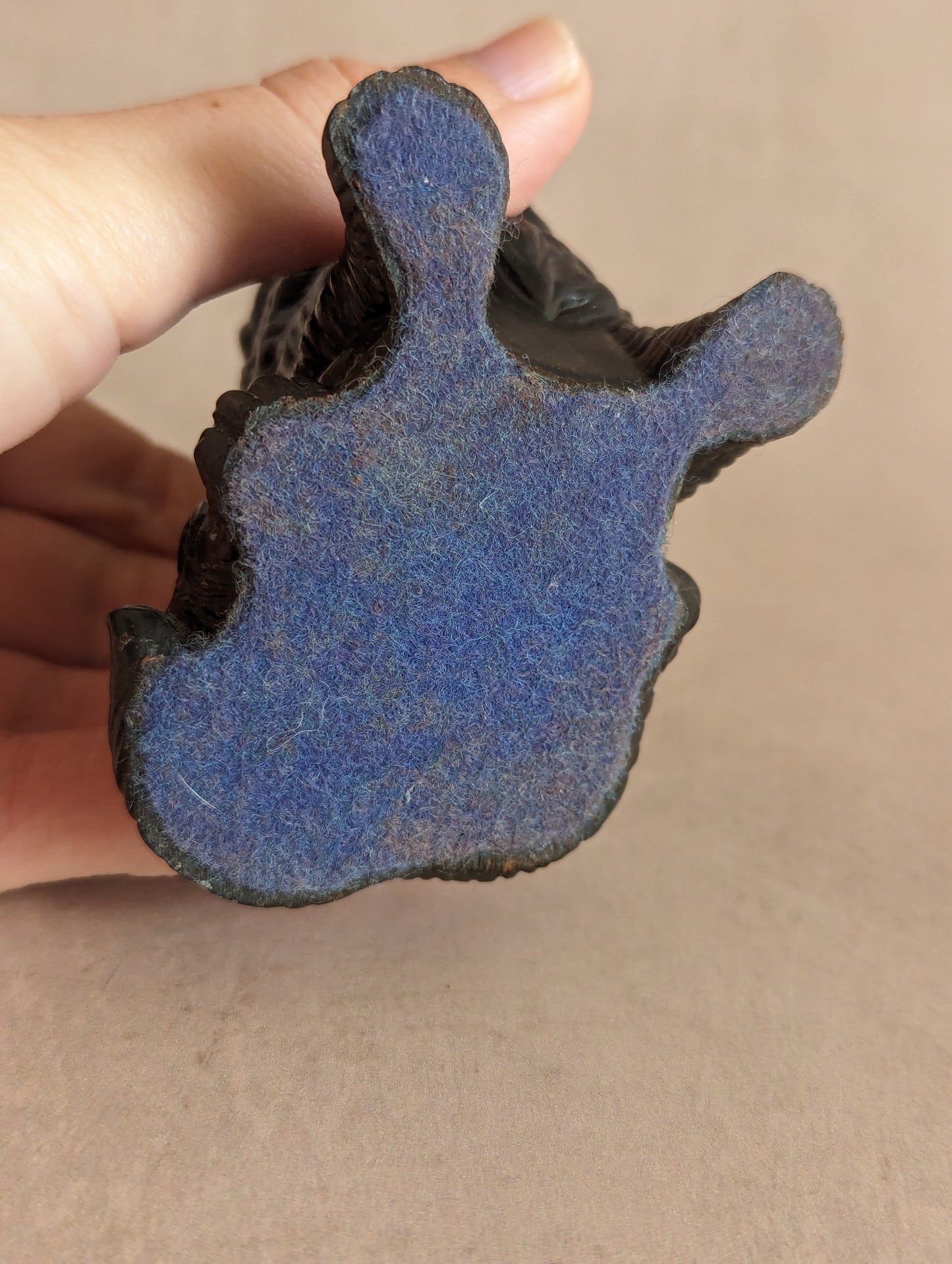 A black resin figurine of an Australian Shepherd dog, vintage from the 1960s-70s. The figurine is finely detailed, depicting the dog in a standing pose.