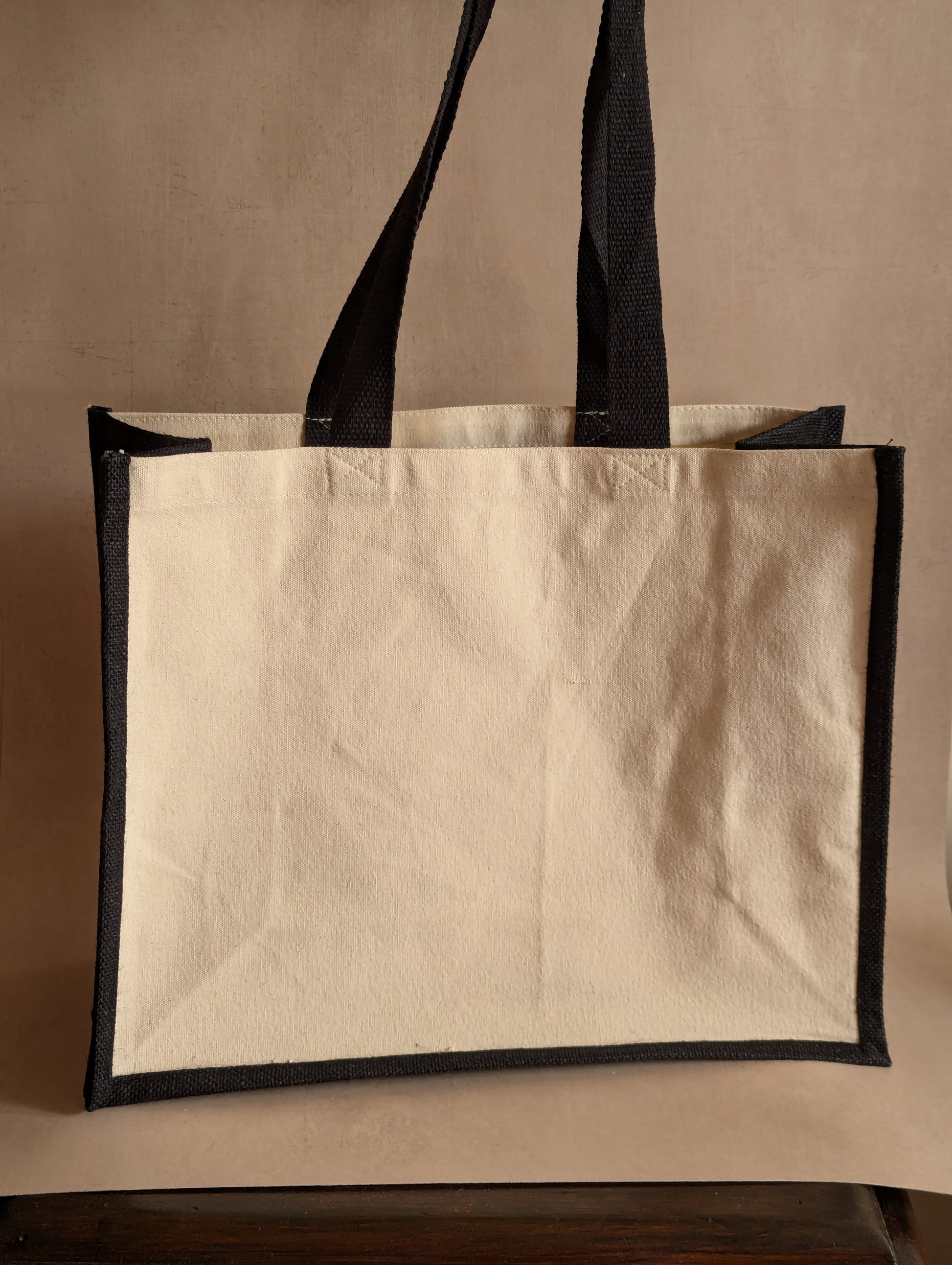 The Antiques Club Jute & Canvas Tote Bag because nothing new is worth the hunt
