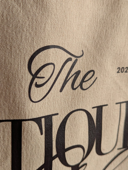 The Antiques Club Jute & Canvas Tote Bag because nothing new is worth the hunt