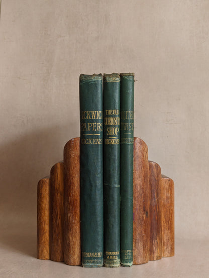 Antique 1870s illustrated Charles Dickens books featuring The Adventures of Oliver Twist, The Old Curiosity Shop, and Pickwick Papers