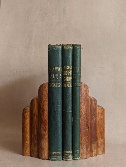 Antique 1870s illustrated Charles Dickens books featuring The Adventures of Oliver Twist, The Old Curiosity Shop, and Pickwick Papers